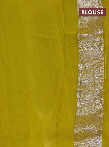 Banarasi chiffon saree black and yellow with silver zari woven buttas and floral silver zari woven border