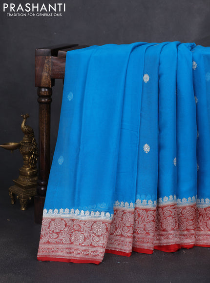 Banarasi chiffon saree cs blue and rust shade with silver zari woven buttas and floral silver zari woven border