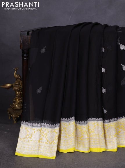 Banarasi chiffon saree black and yellow with silver zari woven buttas and floral silver zari woven border