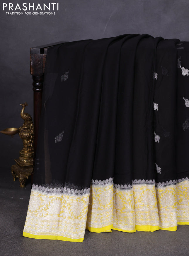 Banarasi chiffon saree black and yellow with silver zari woven buttas and floral silver zari woven border