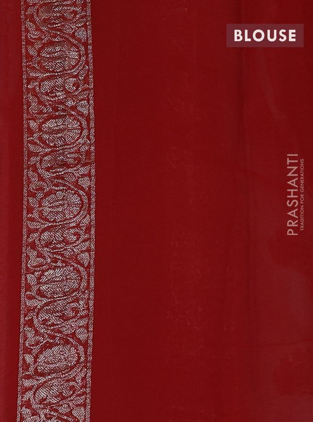 Banarasi chiffon saree mild teal blue and orange with silver zari woven buttas and floral silver zari woven border