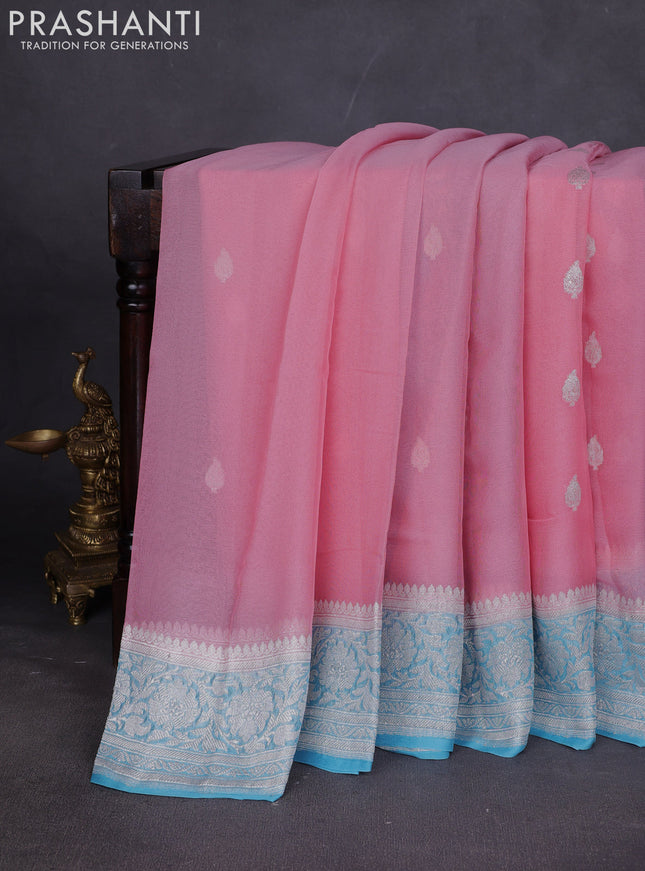 Banarasi chiffon saree mild peach and light blue with silver zari woven buttas and floral silver zari woven border