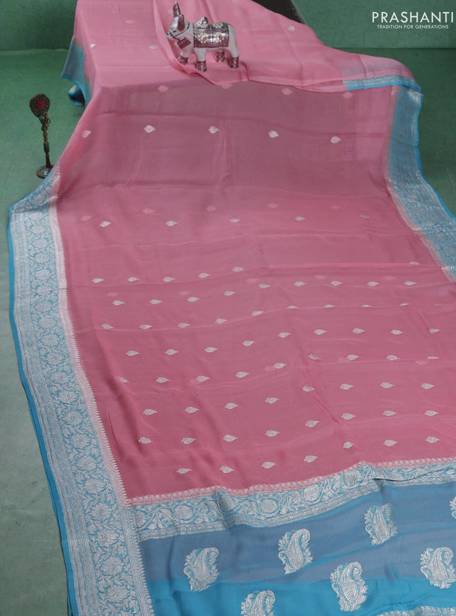 Banarasi chiffon saree mild peach and light blue with silver zari woven buttas and floral silver zari woven border
