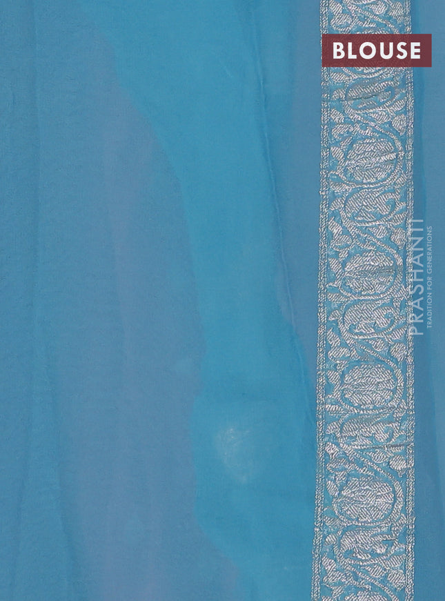 Banarasi chiffon saree mild peach and light blue with silver zari woven buttas and floral silver zari woven border