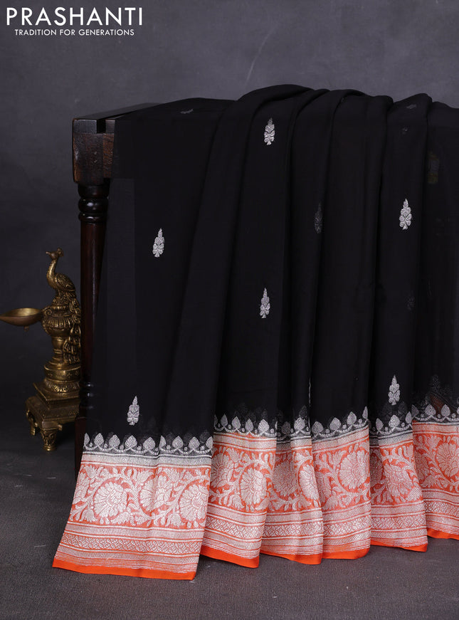 Banarasi chiffon saree black and orange with silver zari woven buttas and floral silver zari woven border