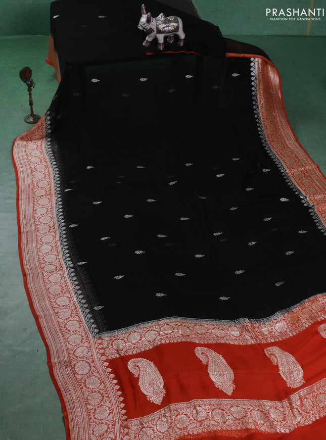 Banarasi chiffon saree black and orange with silver zari woven buttas and floral silver zari woven border