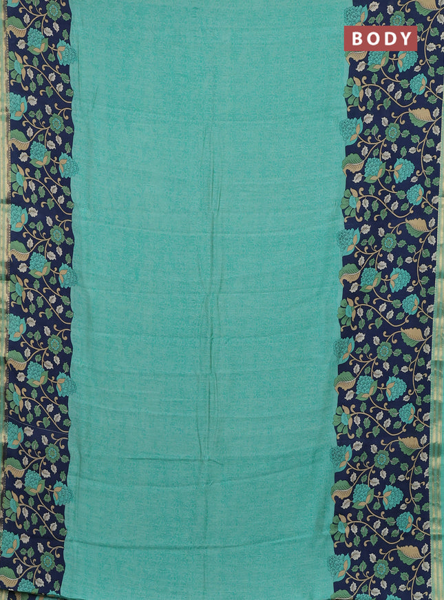 Muslin silk saree teal green shade and navy blue with allover prints and long kalamkari printed zari border