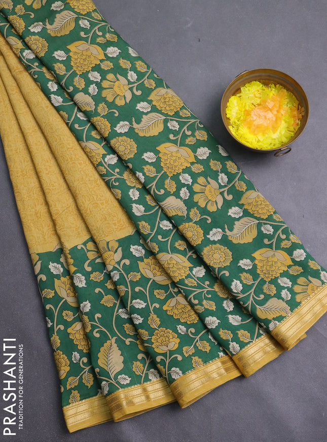 Muslin silk saree mustard yellow and green with allover prints and long kalamkari printed zari border