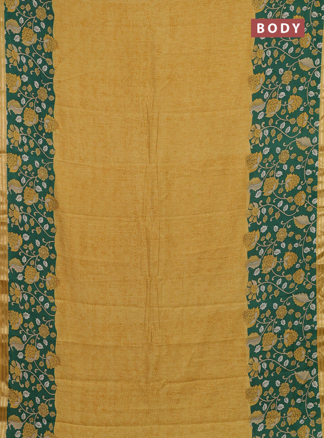Muslin silk saree mustard yellow and green with allover prints and long kalamkari printed zari border