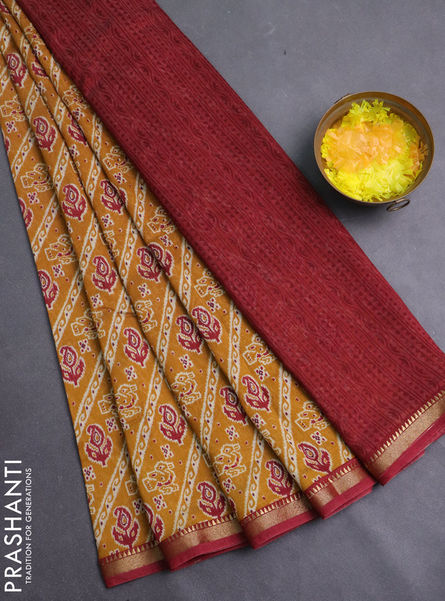 Muslin silk saree mustard yellow and maroon with allover ikat prints and zari woven border