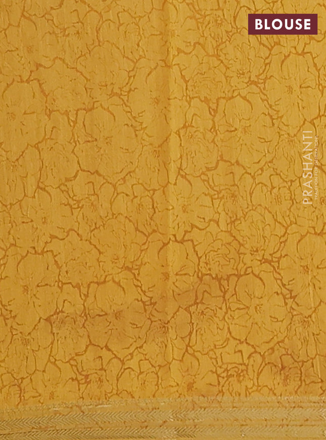 Muslin silk saree green and mustard yellow with allover floral prints and zari woven border