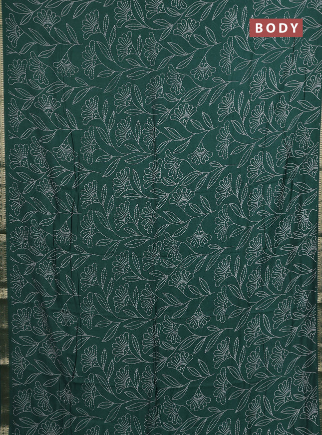 Muslin silk saree dark green with allover floral prints and zari woven border