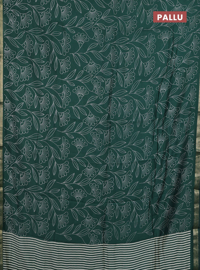 Muslin silk saree dark green with allover floral prints and zari woven border