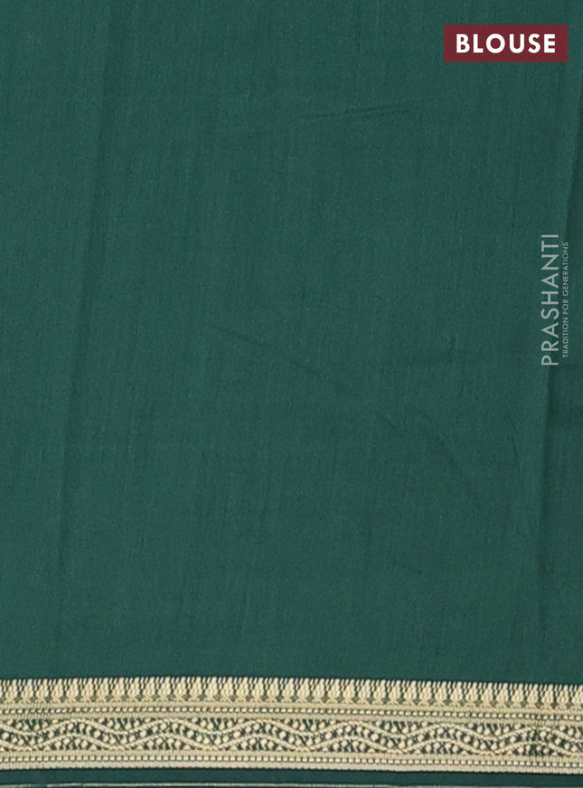 Muslin silk saree dark green with allover floral prints and zari woven border