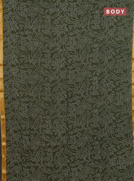 Muslin silk saree sap green and mustard yellow with allover bandhani prints and zari woven border