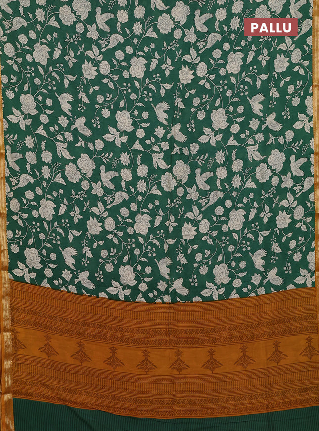 Muslin silk saree green and mustard yellow with allover prints and zari woven border