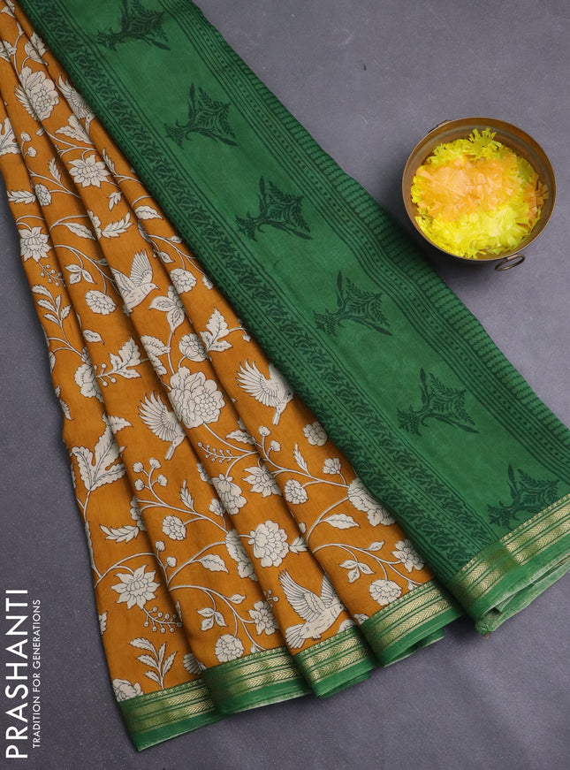 Muslin silk saree mustard yellow and green with allover prints and zari woven border