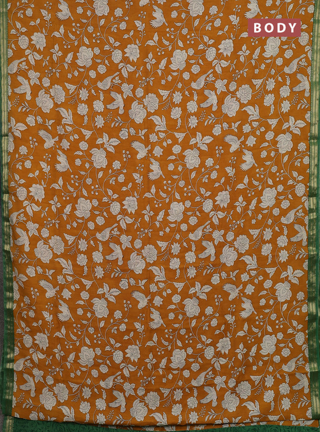 Muslin silk saree mustard yellow and green with allover prints and zari woven border