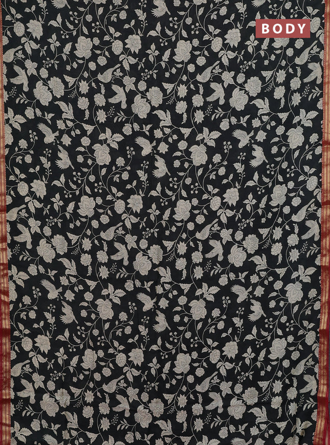 Muslin silk saree black and maroon with allover prints and zari woven border