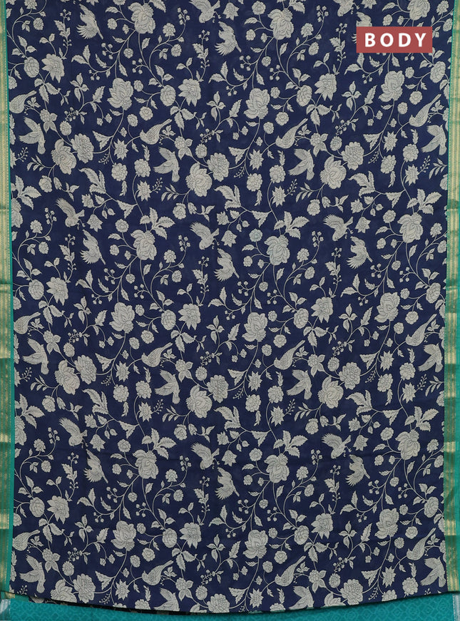 Muslin silk saree navy blue and teal green with allover prints and zari woven border