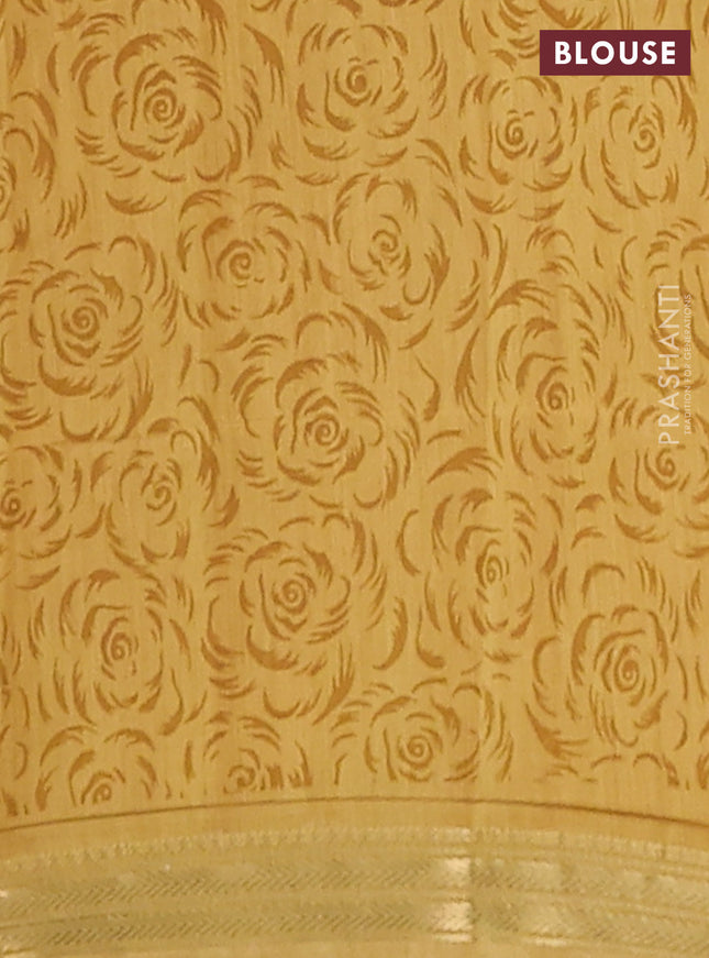 Muslin silk saree green and mustard yellow with allover floral prints and zari woven border