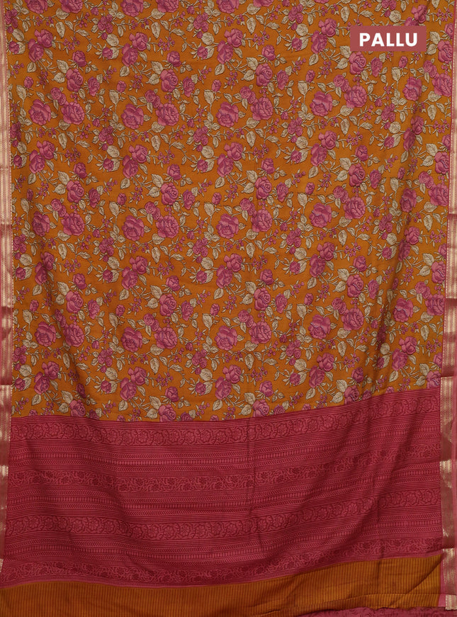 Muslin silk saree dark mustard and peach shade with allover floral prints and zari woven border