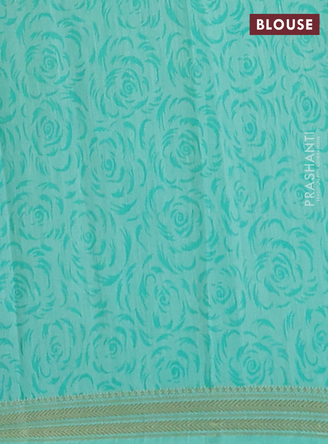 Muslin silk saree navy blue and teal green with allover floral prints and zari woven border