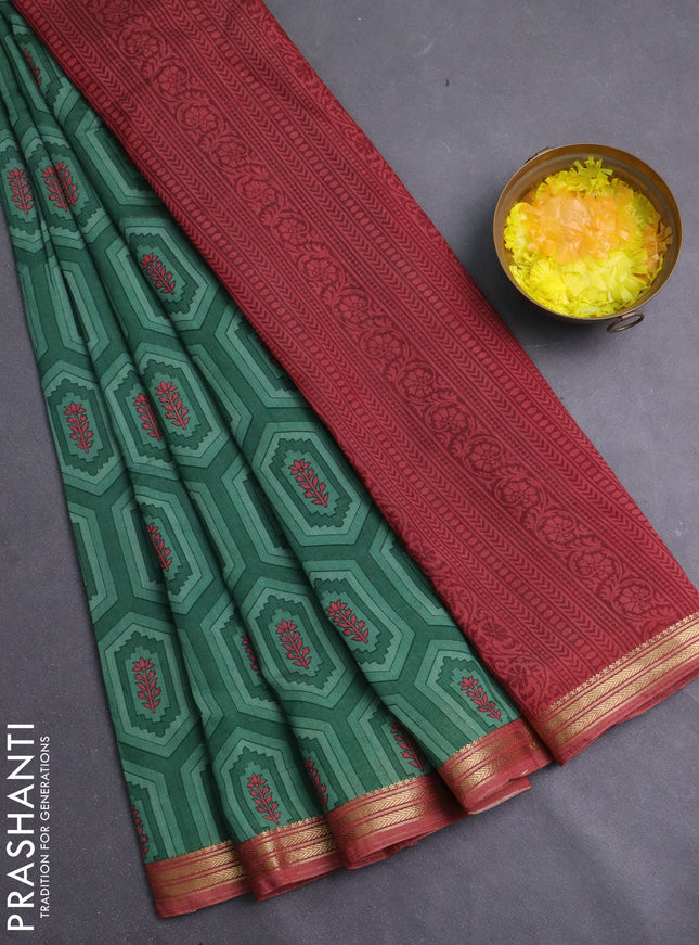 Muslin silk saree green and dark peach with allover geometric prints and zari woven border