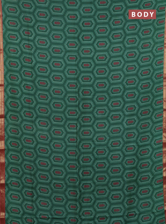 Muslin silk saree green and dark peach with allover geometric prints and zari woven border