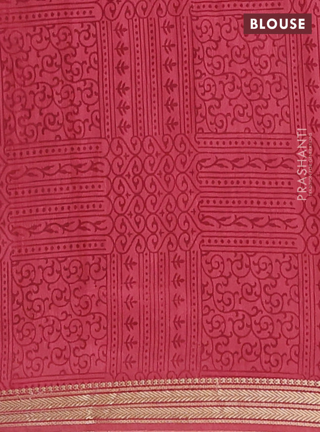 Muslin silk saree green and dark peach with allover geometric prints and zari woven border