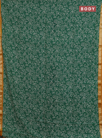 Muslin silk saree green and mustard yellow with allover prints and zari woven border