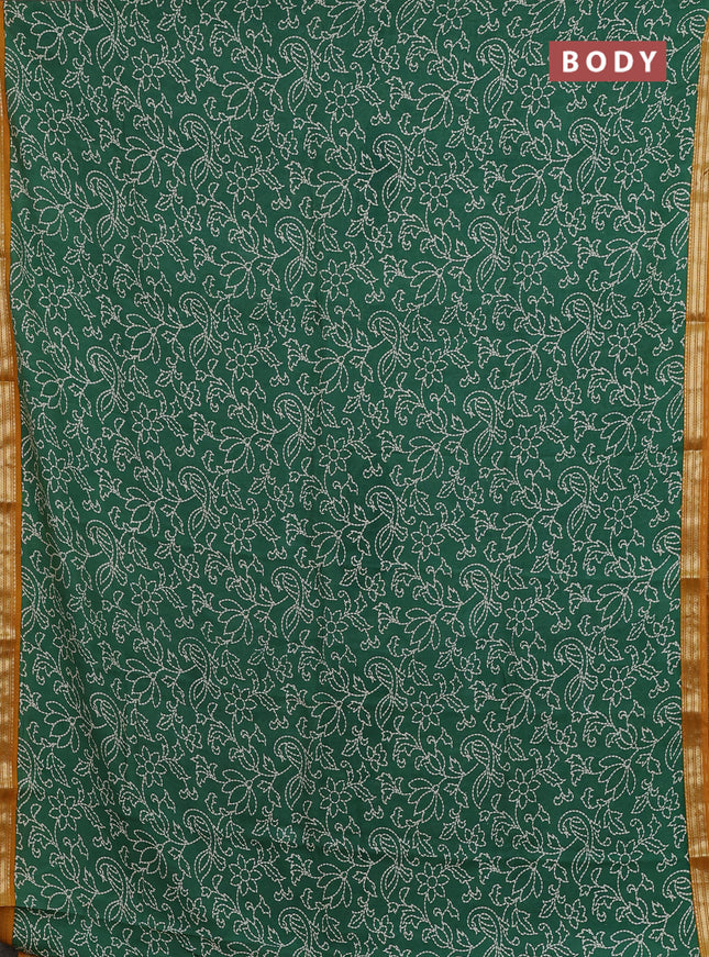Muslin silk saree green and mustard yellow with allover prints and zari woven border