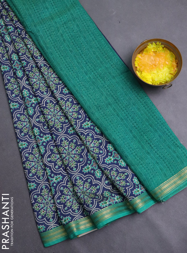 Muslin silk saree blue and teal green with allover prints and zari woven border