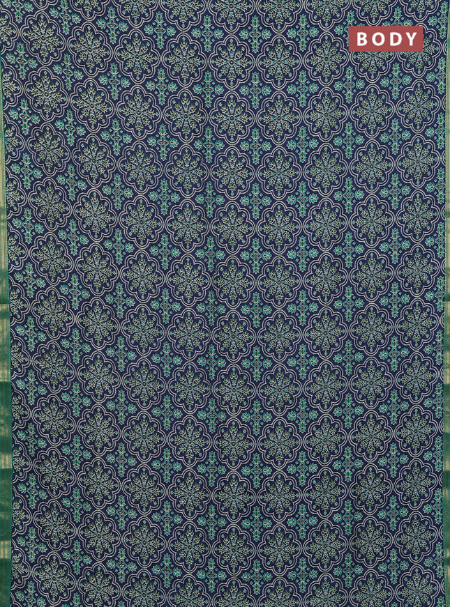 Muslin silk saree blue and teal green with allover prints and zari woven border