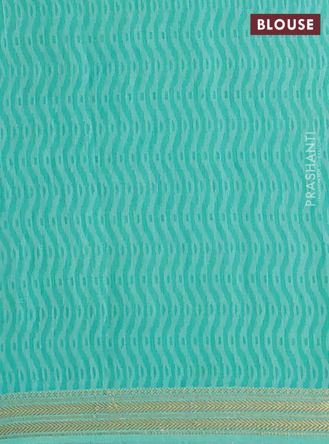 Muslin silk saree blue and teal green with allover prints and zari woven border