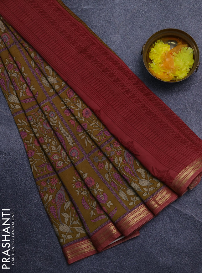 Muslin silk saree dark mustard and dark peach with allover prints and zari woven border
