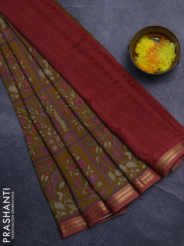 Muslin silk saree dark mustard and dark peach with allover prints and zari woven border