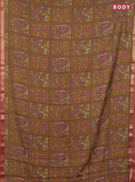 Muslin silk saree dark mustard and dark peach with allover prints and zari woven border