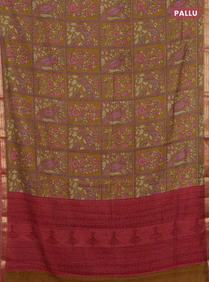 Muslin silk saree dark mustard and dark peach with allover prints and zari woven border
