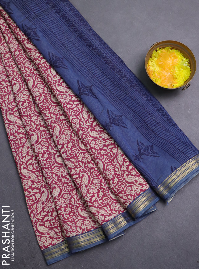 Muslin silk saree dark pink and blue shade with allover peacock prints and zari woven border