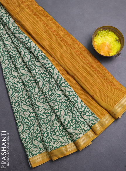 Muslin silk saree green and mustard yellow with allover peacock prints and zari woven border