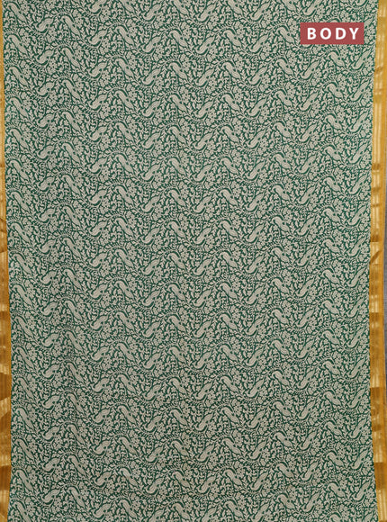 Muslin silk saree green and mustard yellow with allover peacock prints and zari woven border