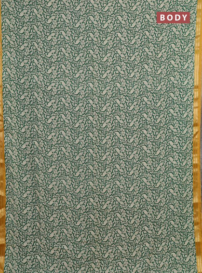 Muslin silk saree green and mustard yellow with allover peacock prints and zari woven border