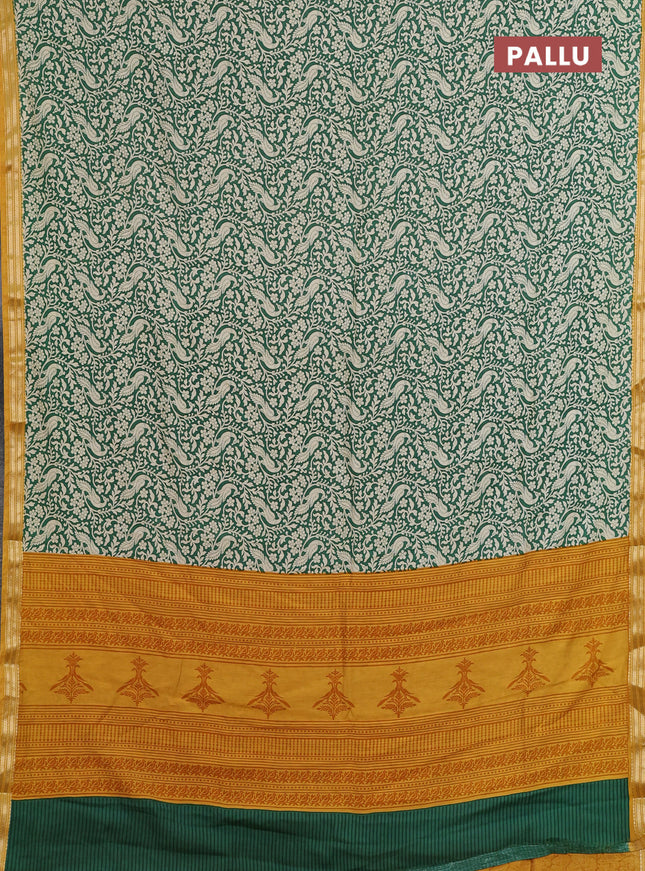 Muslin silk saree green and mustard yellow with allover peacock prints and zari woven border