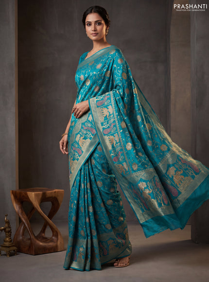 Banarasi semi raw silk saree teal blue with allover floarl zari weaves and thread & zari woven border