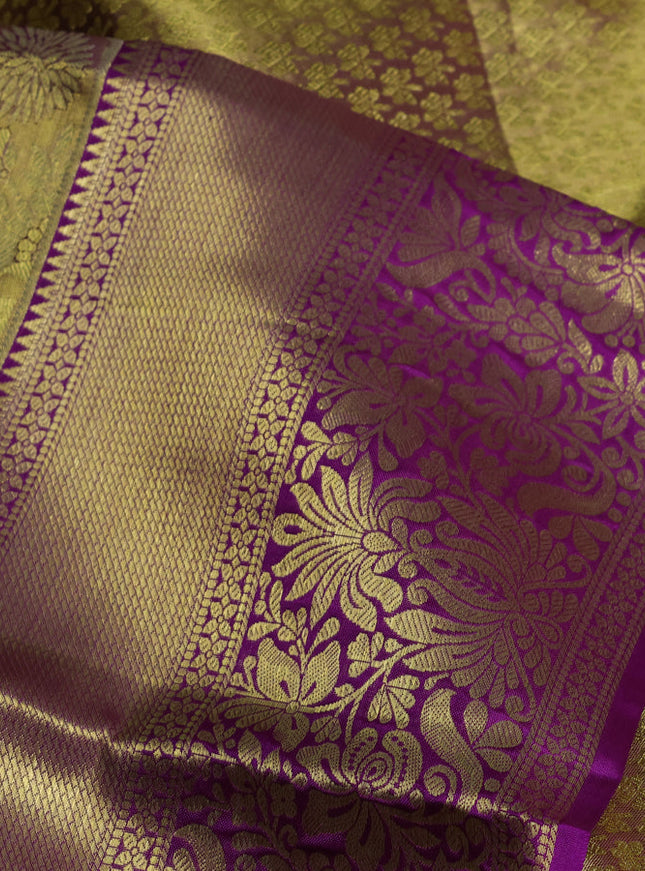 Pure kanchipuram tissue silk saree dual shade of gold and purple with allover floral zari woven brocade weaves and zari woven border
