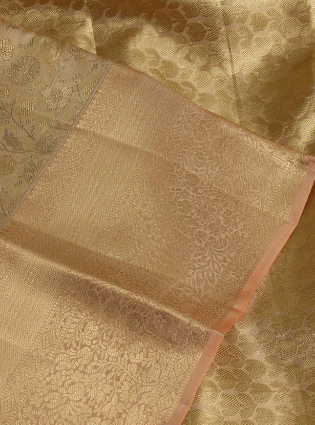 Pure kanchipuram tissue silk saree sandal and pastel peach with allover floral zari woven brocade weaves and zari woven border