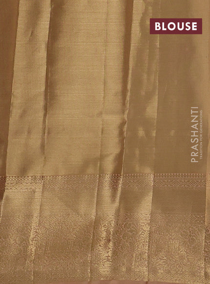 Pure kanchipuram tissue silk saree sandal and pastel peach with allover floral zari woven brocade weaves and zari woven border