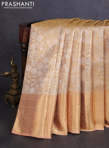 Pure kanchipuram tissue silk saree mild peach shade with allover floral zari woven brocade weaves and zari woven border