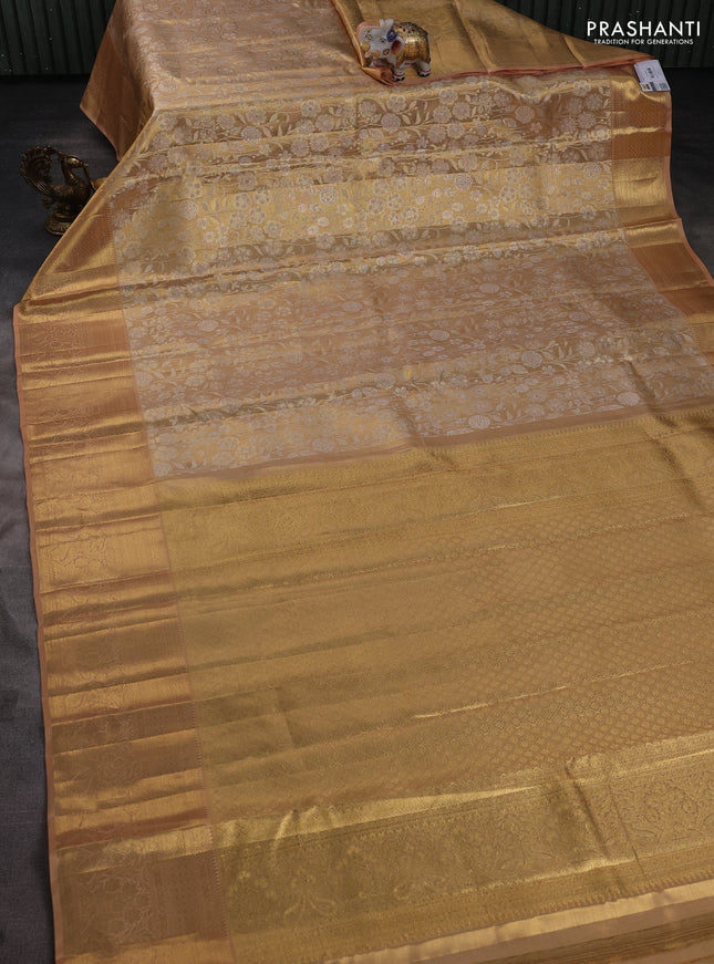 Pure kanchipuram tissue silk saree mild peach shade with allover floral zari woven brocade weaves and zari woven border